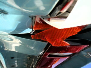 Head on motor vehicle collision with broken head lights.