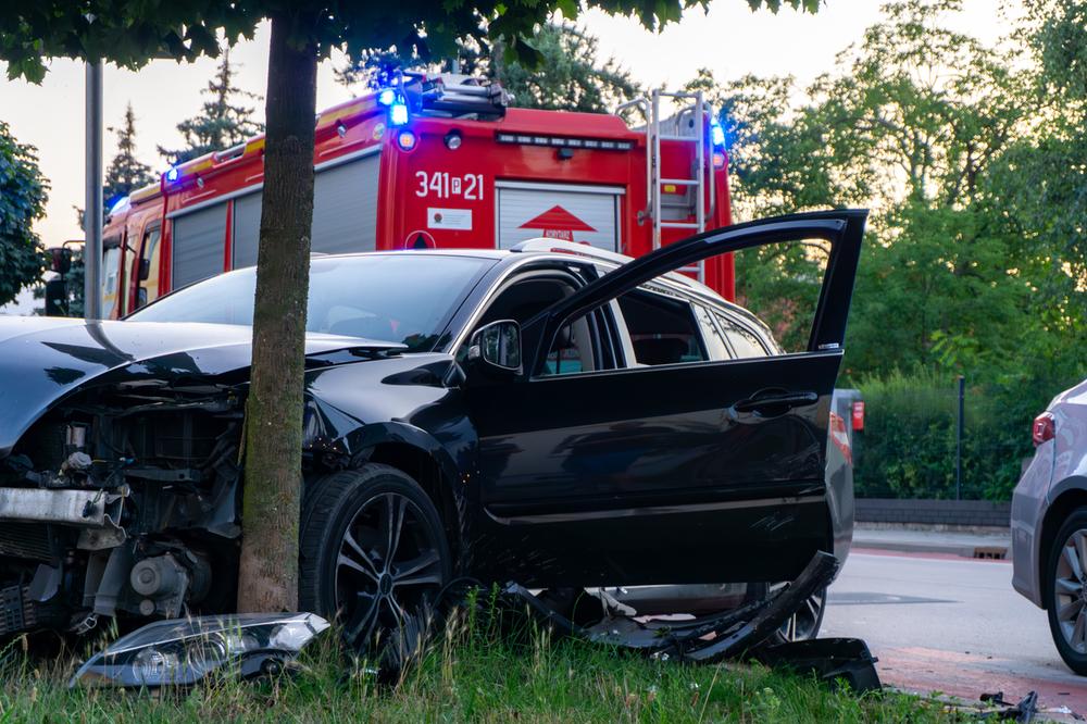 springfield-car-accident-lawyers photo of a car crashed into a telephone pole. The driver may need a car accident lawyer Springfield, MA